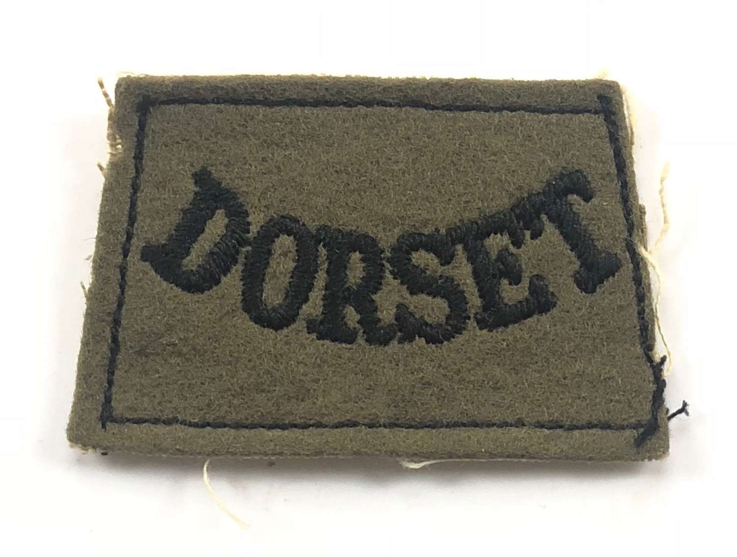 WW2 Dorset Regiment Slip on Shoulder Title.