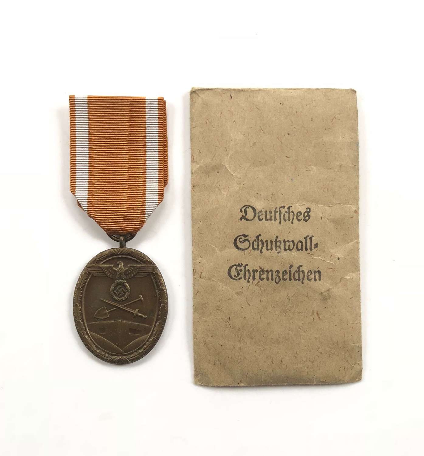 WW2 German West Wall Medal and original packet.